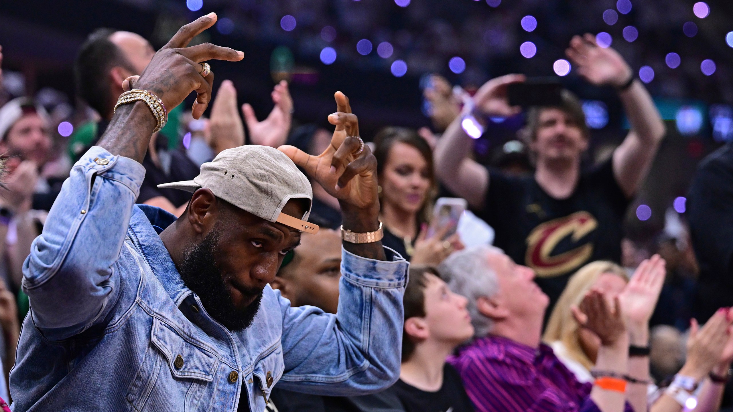 LeBron James Receives Rousing Ovation While Sitting Courtside for Celtics Game